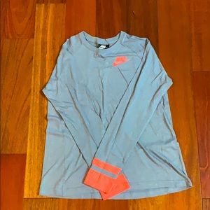 Light navy and bright pink Nike shirt.
